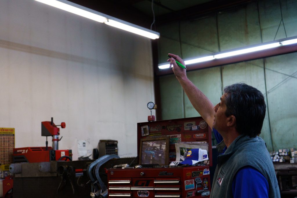 Energy specialist inspecting commercial lighting fixtures