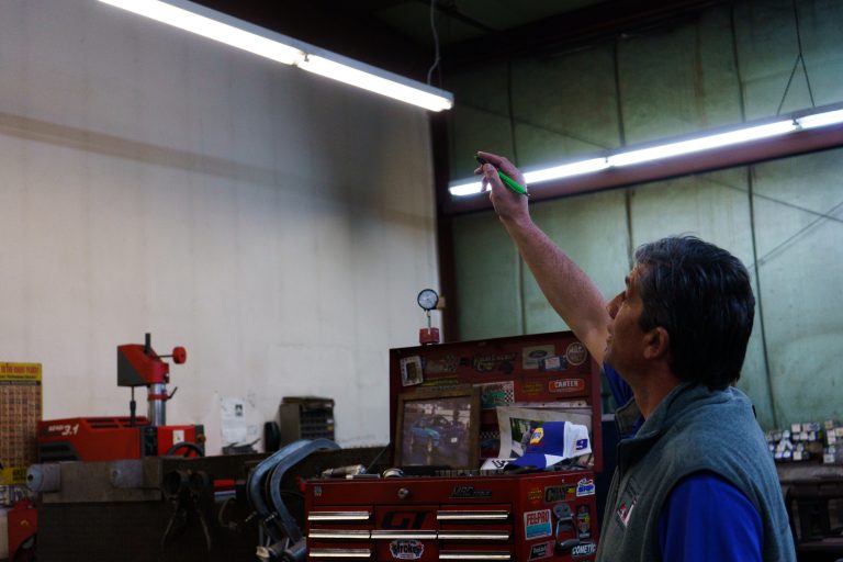 Energy specialist inspecting commercial lighting fixtures
